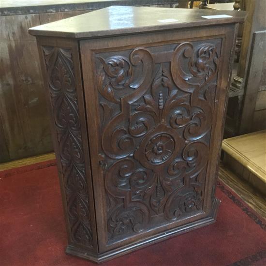 Small carved oak corner cupboard